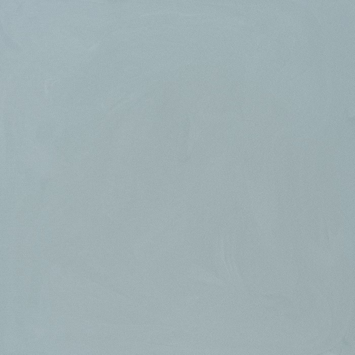 Eine glatte Oberfläche mit einer sanften, gedämpften blauen Farbe. Die Textur scheint leicht reflektierend und verleiht ihr ein poliertes Aussehen. Die subtilen Farbvariationen erzeugen einen beruhigenden visuellen Effekt, der sich gut für eine entspannende Umgebung eignet.