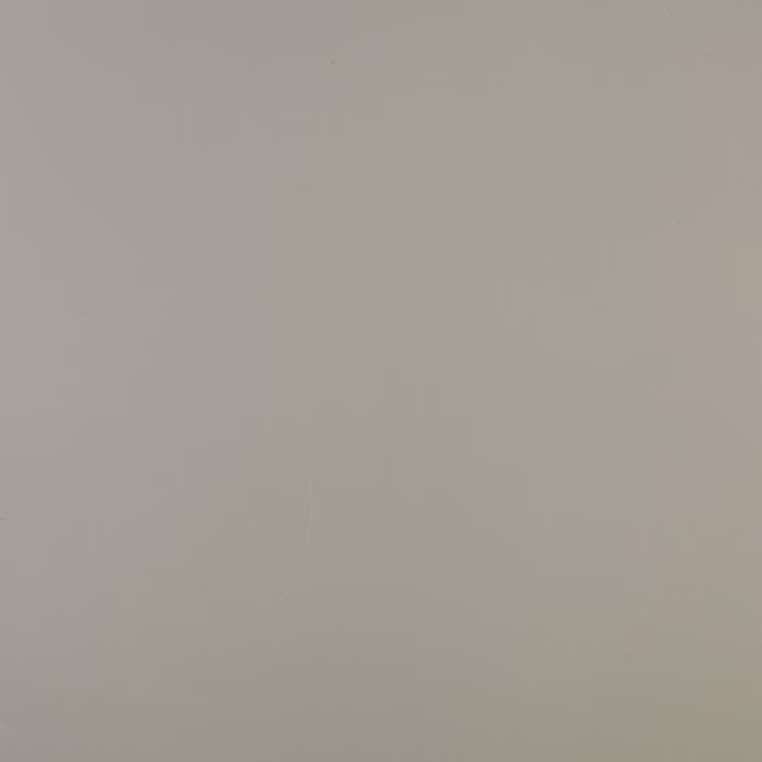 Eine strukturierte Oberfläche in einem sanften, neutralen Grauton, die eine ruhige und minimalistische Ästhetik erzeugt.